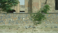 Задул афганец — деревья еле стоят,на здании следы от снарядов.