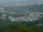 Купола православного храма и голубой бассейн гостиницы Термаль