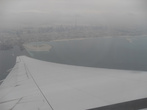 Под крылом самолета о чем-то поет синее море Персидского залива....